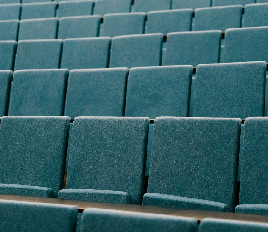 Sports Marketing Manager with a name tag and title